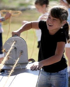 Jenna Niland a fourth grader at Eisenhower Elementary in McPherson strains to turn the crank while spinning rope at the Central Kansas Flywheels Educational Day on Friday, Oct. 8, 2010. The event was for students from local and regional schools. (photo by Jeff Cooper/ Salina Journal)